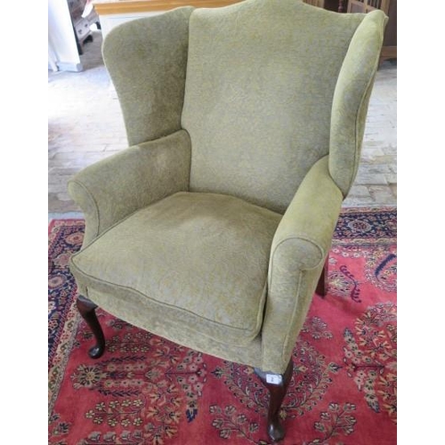 2 - A Queen Anne style upholstered wing back chair, 102cm tall x 78cm wide