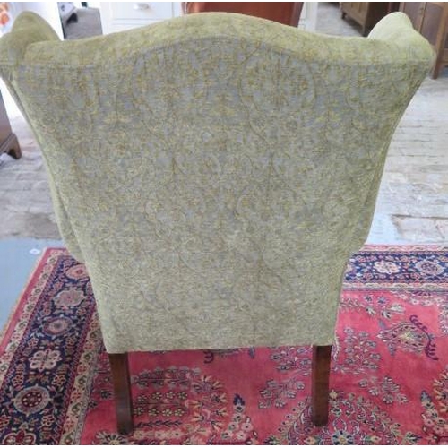 2 - A Queen Anne style upholstered wing back chair, 102cm tall x 78cm wide