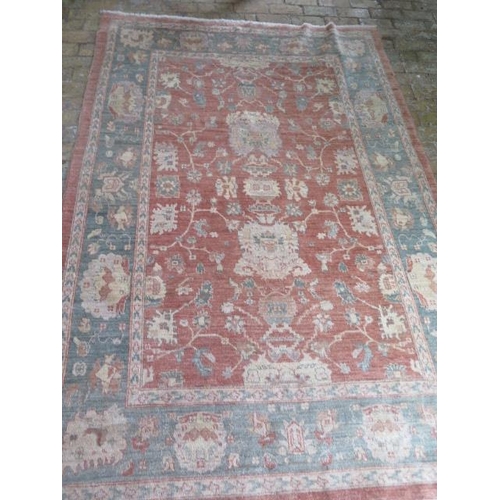 204 - A hand knotted woollen rug, 260cm x 174cm