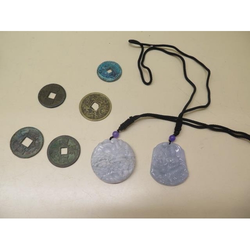 294 - Two Chinese glass pendants and 5 metal tokens