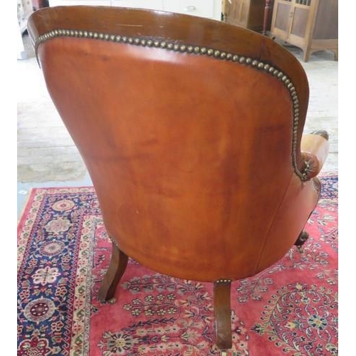 51 - A Victorian mahogany button back tan leather library / club armchair, 92cm tall x 67cm wide x 72cm d... 