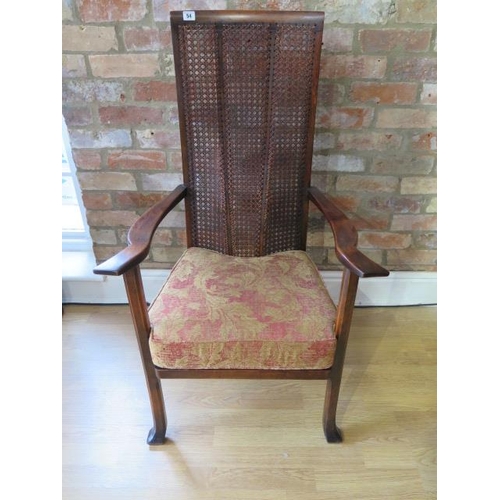 54 - A beechwood caned high back open armchair with cushion