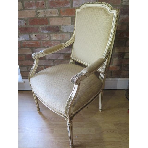 59 - A French carved and painted open armchair, recently reupholstered