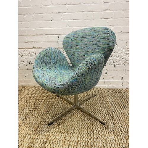 35 - AFTER ARNE JACOBSEN SWAN CHAIR, polished aluminum swivel base, upholstered in designers guild fabric... 