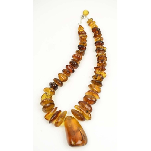 413 - AMBER NECKLACE, from the LA Toca Mine in The Dominican Republic, forty eight transparent beads conta... 