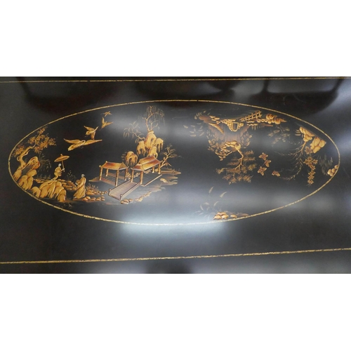 57 - LOW TABLE, 90cm x 48cm H x 178cm, black with gilt Chinoiserie detail.