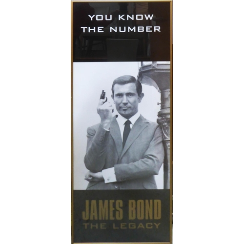65 - JAMES BOND POSTER 'George Lazenby', James Bond the Legacy, 106cm x 41cm, framed.