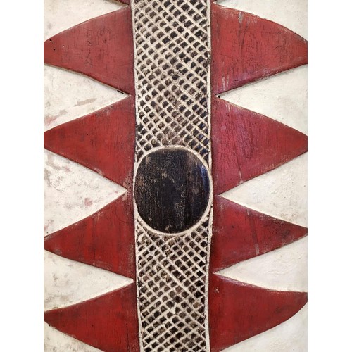 366 - FANG SHIELDS, a pair, Gabon red, black, white, carved wood, painted finish, 133cm x 35cm. (2)