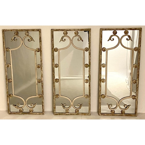 121 - ARCHITECTURAL WALL MIRRORS, a set of three, 111cm x 48cm, aged metal frames. (3)