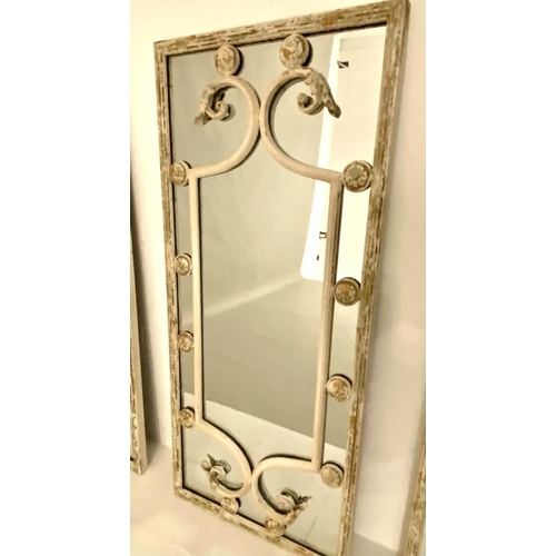 121 - ARCHITECTURAL WALL MIRRORS, a set of three, 111cm x 48cm, aged metal frames. (3)
