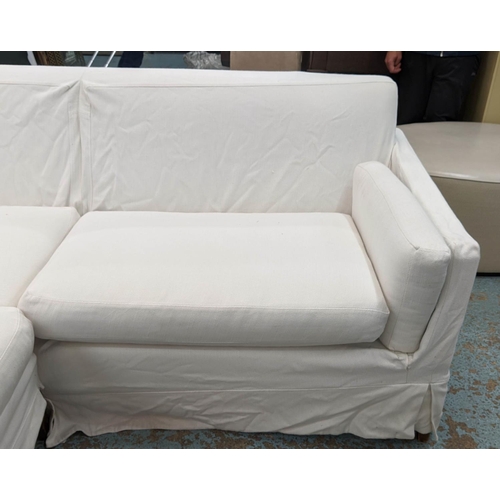 77 - CORNER SOFA, 240cm x 200cm x 85cm, contemporary design, loose white fabric covers.