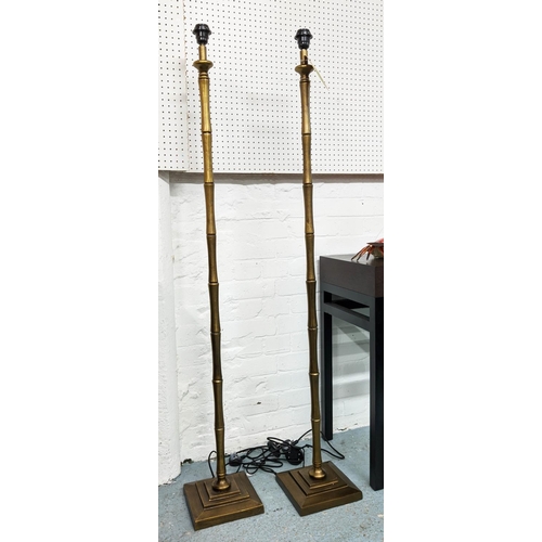 99 - FAUX BAMBOO FLOOR LAMPS, a pair, 150cm gilt metal  (2)