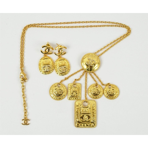 99 - CHANEL NECKLACE AND EARRING SET, pendant gilt metal necklace, all bearing the logo, plus similar pen... 