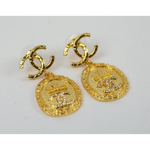 99 - CHANEL NECKLACE AND EARRING SET, pendant gilt metal necklace, all bearing the logo, plus similar pen... 