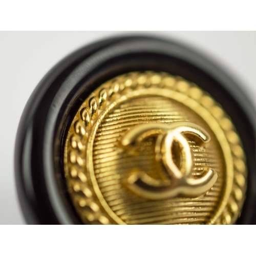 102 - CHANEL EARRINGS, pair, gilt metal centres, black enamelled surrounds, 8.91 grams, logo to back.