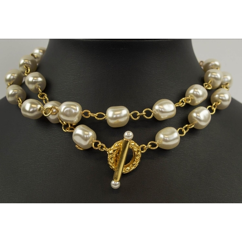 104 - CHANEL NECKLACES, a pair, faux pearl and gold tone, stamped, each with hook and loop clasp can be wo... 