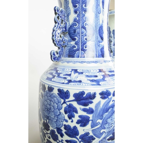 13 - CHINESE BLUE AND WHITE VASES, a pair, on carved wooden stands, 60cm H. (2)