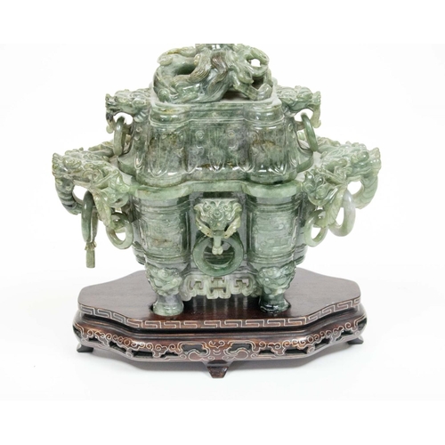 33 - SPINACH JADE CHINESE KORO AND COVER, 20th century, the dragon head handles with loose rings, on carv... 