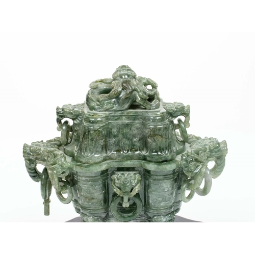 33 - SPINACH JADE CHINESE KORO AND COVER, 20th century, the dragon head handles with loose rings, on carv... 