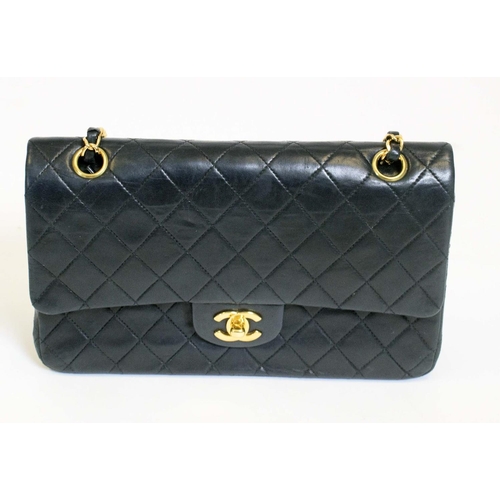 49 - CHANEL FLAP BAG, with front double flap closure, quilted effect and gold hardware, chain and leather... 