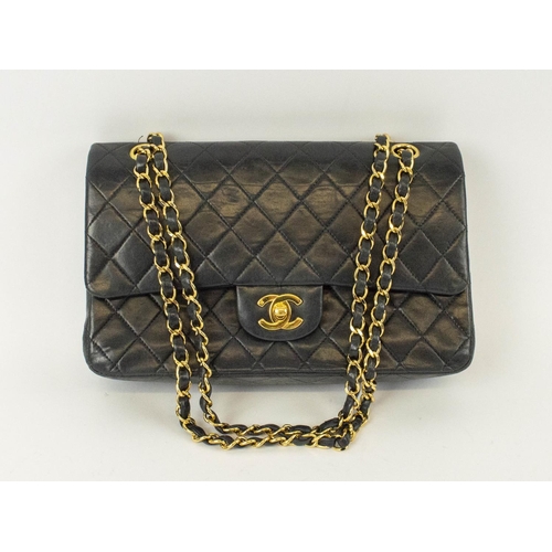 49 - CHANEL FLAP BAG, with front double flap closure, quilted effect and gold hardware, chain and leather... 