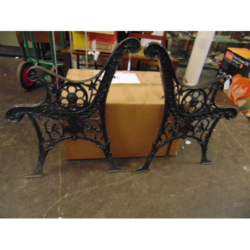 Pair of cast iron bench ends.