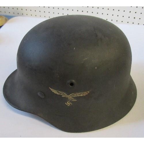 A WW2 German style helmet, with eagle carrying a swastika em... | Barnebys
