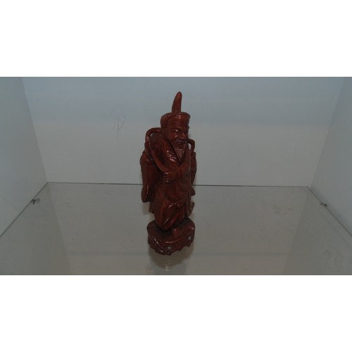 34 - Carved statue of oriental man fishing