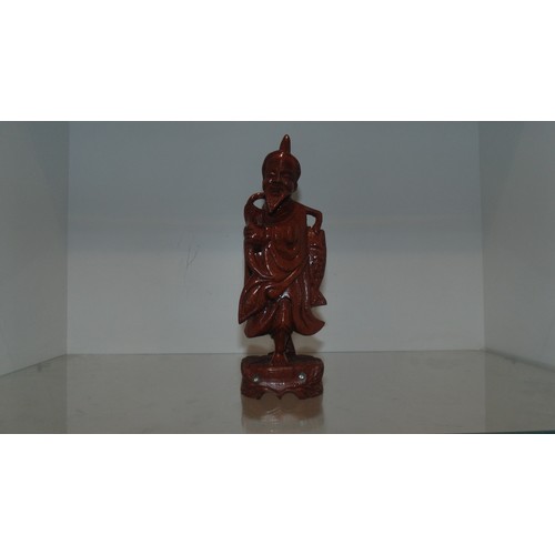 34 - Carved statue of oriental man fishing