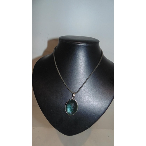 3054 - Rope necklace with oval glass pendant with a tint of blue