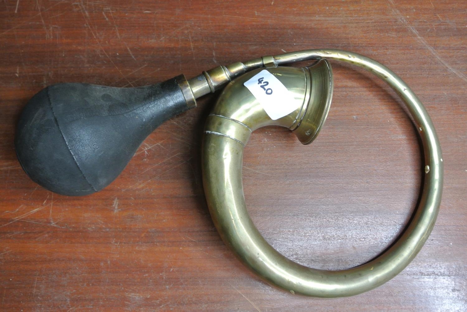 An antique/ vintage brass car horn.