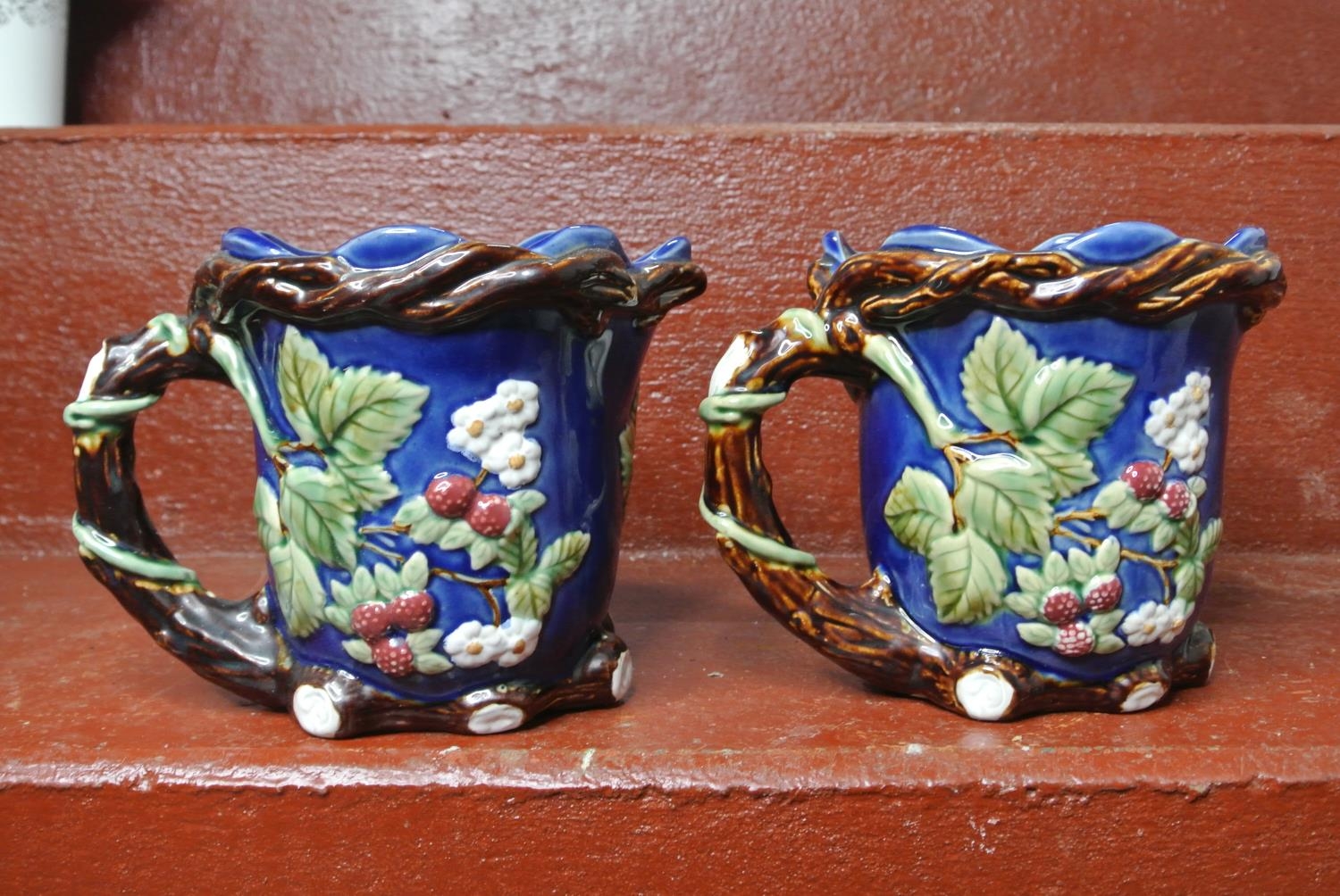 A pair of decorative jugs.
