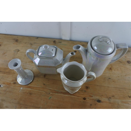 206 - A three piece ceramic tea/coffee set and a matching candlestick.