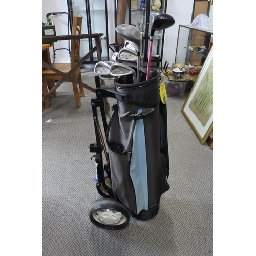 207 - A collection of Ben Sayers golf clubs, bag and trolley.