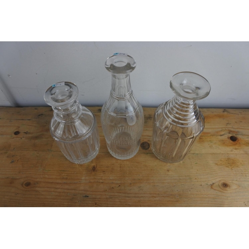 229 - Three early 19th century Irish glass 1/2 pint decanters, one with prismatic cutting to the neck, one... 