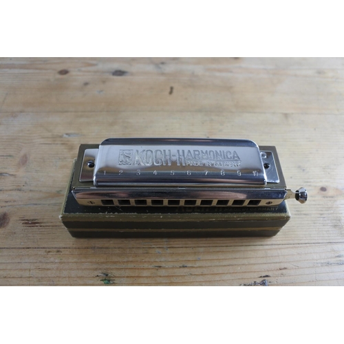 246 - A rare vintage KOCH chromatic 10 hole harmonica in the key of C in perfect tune and in original box.