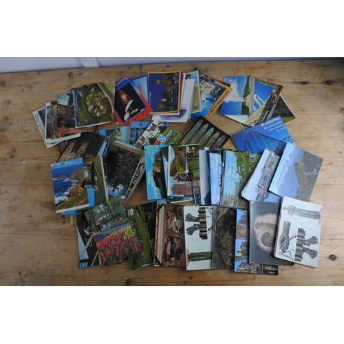285 - A large collection of various postcards.