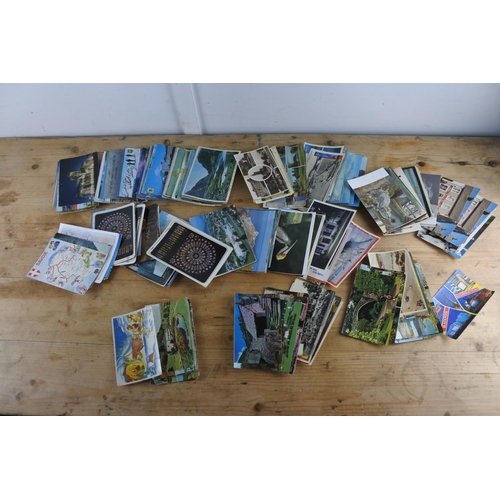 285 - A large collection of various postcards.