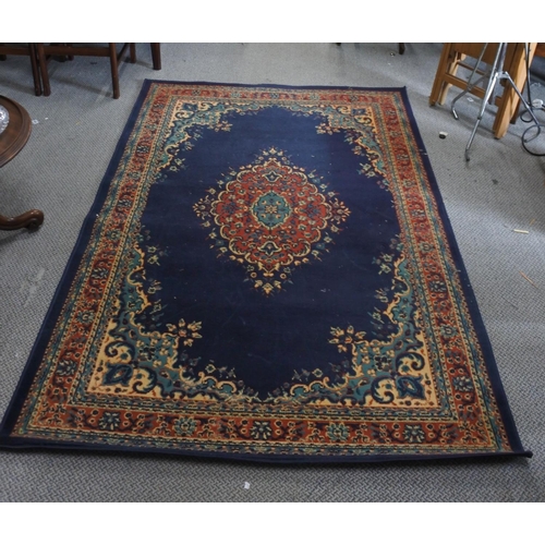 296 - A decorative rug. (Measuring 220x150cm)