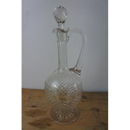 320 - A fine late 19th century glass claret jug with a star-cut circular foot, diamond cut ovoid body with... 
