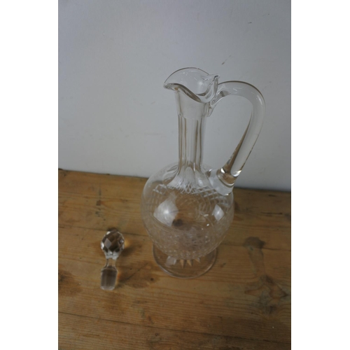 320 - A fine late 19th century glass claret jug with a star-cut circular foot, diamond cut ovoid body with... 