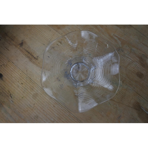 322 - An early twentieth century small clear glass bowl on a circular foot, possibly Stevens & Williams, t... 