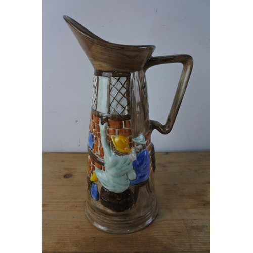 325 - A tall Radford, England hand painted pottery jug.