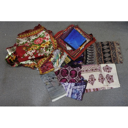 338 - A large assortment of vintage fabric, cushion covers and more.