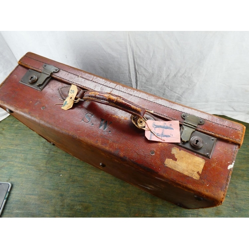 108 - A vintage leather suitcase, monogramed S.W.