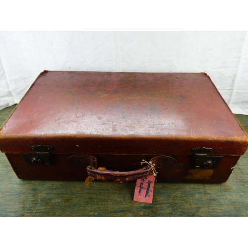 108 - A vintage leather suitcase, monogramed S.W.