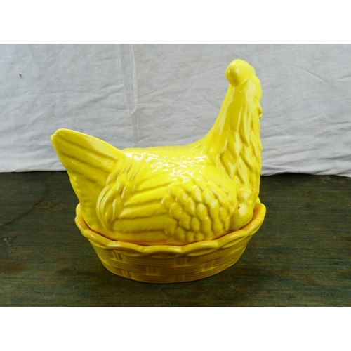 109 - A brightly coloured ceramic hen on nest.