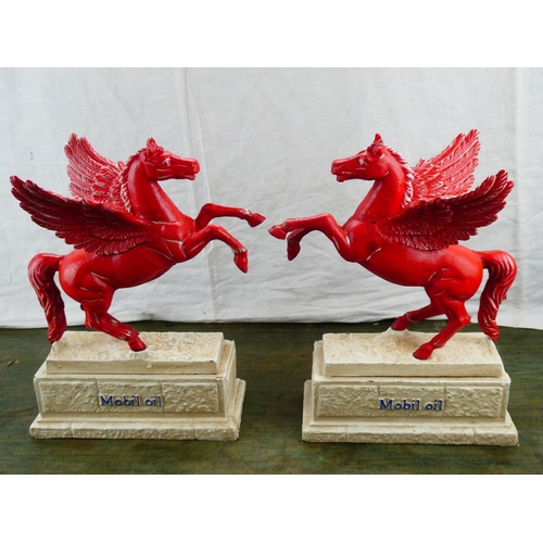 116 - A stunning pair of cast iron reproduction 'Mobil Oil' advertising mascots.