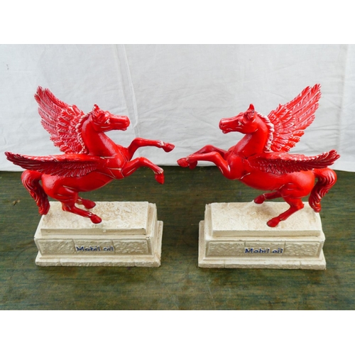 116 - A stunning pair of cast iron reproduction 'Mobil Oil' advertising mascots.