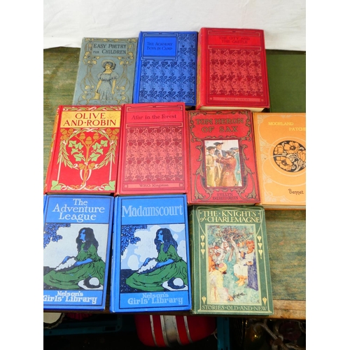 122 - A collection of ten antique children's hardback books decorated in art nouveau/arts & crafts style a... 